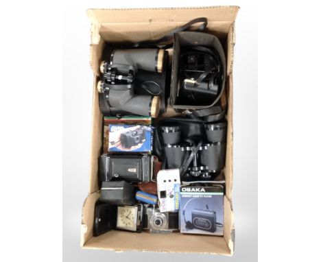 A group of binoculars including Tasco 16X50, Turners 10X50 binoculars, together with a group of vintage and later cameras, in