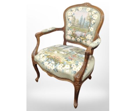 A French carved beech salon armchair in tapestry fabric, width 68 cm  