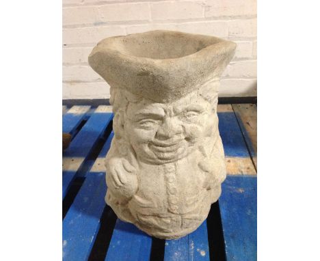 A concrete Toby jug planter, height 42cm.