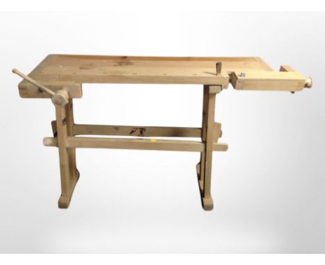 A Scandinavian pine work bench fitted with two vice, length 132 cm 