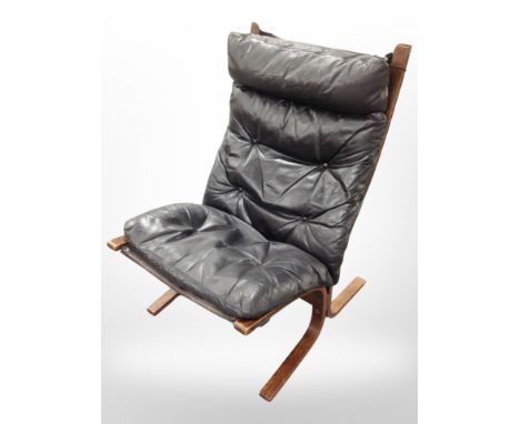 A 20th century Danish bentwood and black button leather lounge chair, width 65 cm 