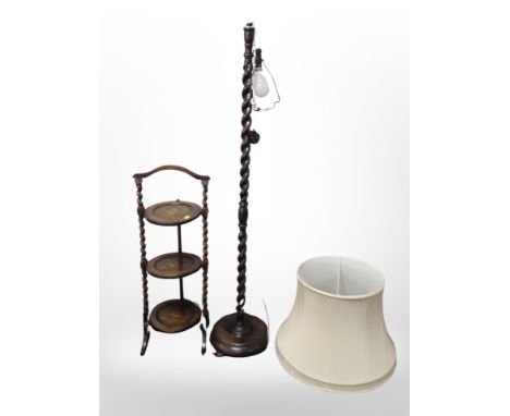 An Edwardian oak cake stand and a standard lamp 