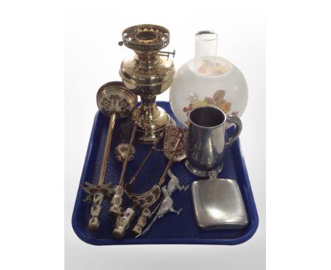 An enamelled brass fire companion set, together with an oil lamp with opaque glass shade, a tankard, a hip flask, etc.