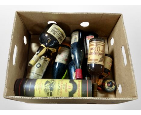 Assorted bottles of alcohol including Gran Marnier, Teacher's Highland Cream Scotch Whisky, Glenmorangie 10-years-old Pure Hi