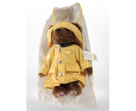 A Steiff RNLI teddy bear with tags and protective cloth bag.