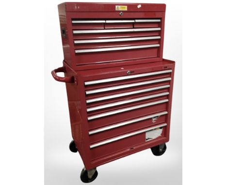 An enameled metal mechanic's storage trolley, with multiple drawers containing some tools.