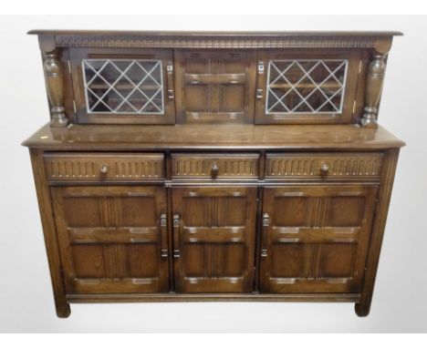 An Ercol stained elm buffet sideboard, 152 cm wide x 46 cm deep x 124 cm high 