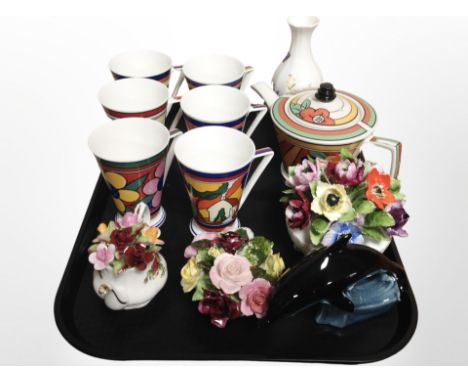 A Past Times reproduction Clarice Cliff-style teapot, together with six Art Deco-style mugs by Wren giftware, together with a