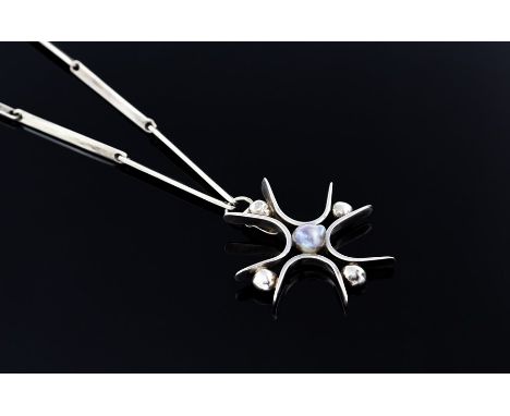 A 1970's silver and black pearl pendant necklace, the stylised cross pendant with a pearl to centre, on flat rectangular link