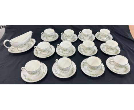 Selection of twelve wedgwood cup and saucers, gravy boat etc   damage to one plate