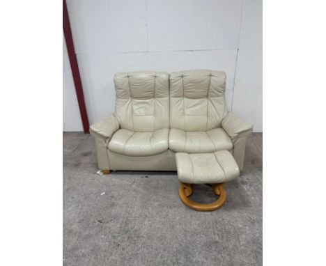 Erkness reclining cream two seater sofa and footstool over all good condition 
