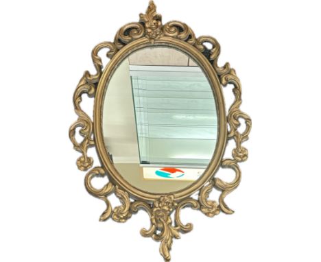 Vintage gilt framed mirror measures approximately 33 inches by 21 inches 