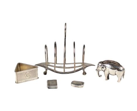 Collection consisting of: elephant pin cushion, London circa 1904; triangular English napkin holder, mono "MEW"; toast rack L