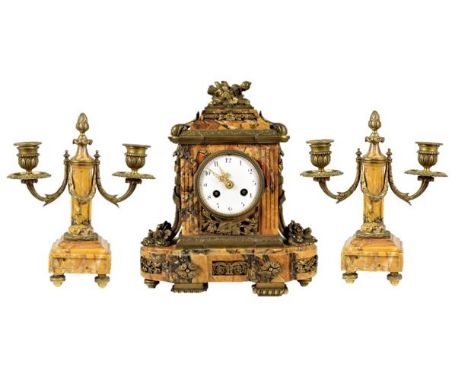 Movement signed Daubref. Beautiful French bronze and gilt clock set with two separate candelabras. Pineapple gilt motiff at t