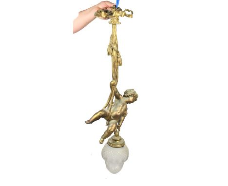 Beautiful French bronze hanging lamp, likely from the House of Baccarat. That of a charming dangling cherub or putti holding 