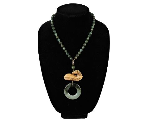 Jade Pendant with a bone horse and gold clasp. Please note that all sales are final. No refunds will be given under any circu