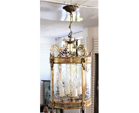 French gilt metal early 20th century crystal chandelier. Exquisitely beautiful, this barrel shaped four-sided cut crystal tul
