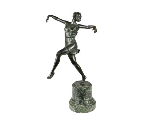 Art deco. Figure of a dancer, she is standing on her toes and reaching out with arms wide open. Statue is signed on its bronz