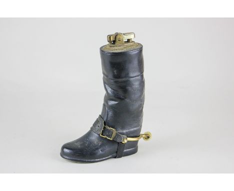 A novelty porcelain cigarette lighter in the form of a riding boot, 16cm, (NC)