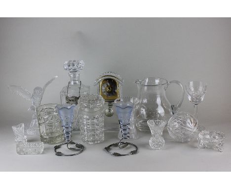 A collection of various cut and moulded glass, to include a spirit decanter, water jug, a pair of epergnes, a clock and other