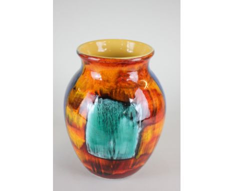 A Poole Pottery vase, baluster form, in turquoise, red, orange and blue block colours, 25cm high