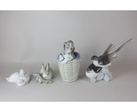 Three Lladro porcelain models of animals including two birds, a rabbit and a dog in a basket, together with a Nao model of tw