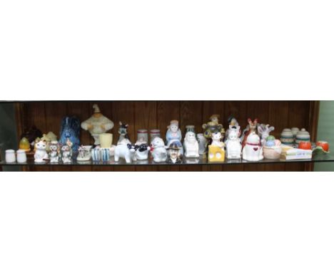 A SHELF FULL OF DOMESTIC CERAMICS the majority being novelty cruets 