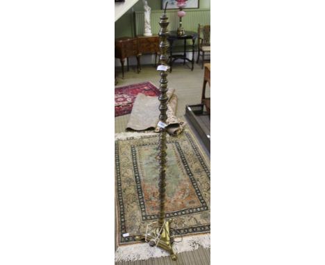 A BRASS STANDARD LAMP on plain tricorn base 
