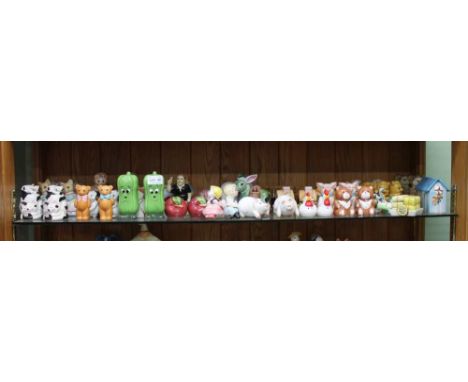 A SHELF FULL OF NOVELTY COLLECTABLE CRUETS 