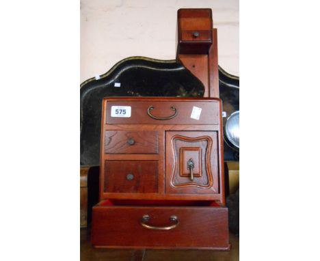 A vintage Japanese wooden sewing box with removal pin cushion and ruler holder and metal handles