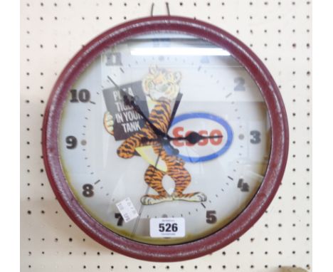 A reproduction Esso tin wall timepiece with battery movement