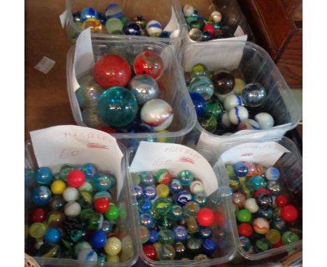 Seven tubs of assorted vintage marbles including opaque swirl, etc.