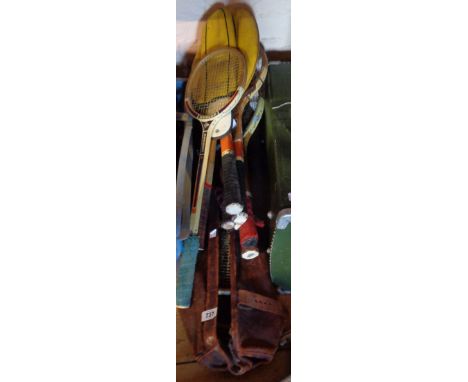 A vintage leather sports bag containing four squash rackets - sold with seven other vintage and later squash and tennis racke