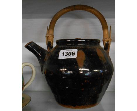 A Winchcombe pottery stoneware teapot decorated with a tenmoku glaze