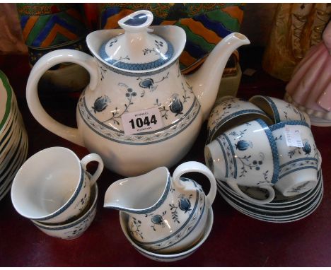 A vintage Royal Doulton Cambridge pattern coffee set comprising coffee pot, cream and sugar and six cups and saucers