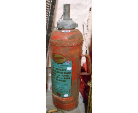 A vintage Conquest water type fire extinguisher in red livery with transfer printed decal