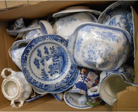 A box containing assorted ceramic items including blue and white tureens, etc.