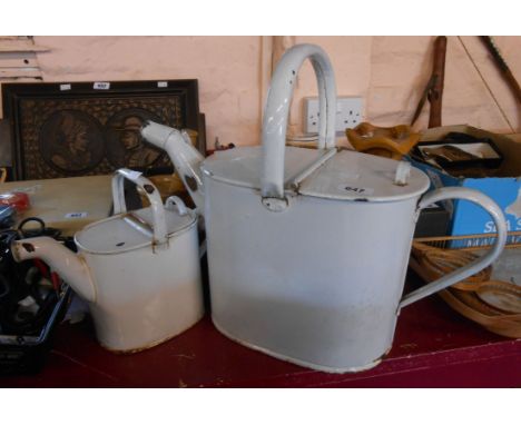 A large enamel hot water jug of watering can form - sold with a smaller similar