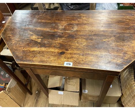 An 86cm 19th Century mahogany and strung fold-over card table with canted front corners, set on square tapered legs