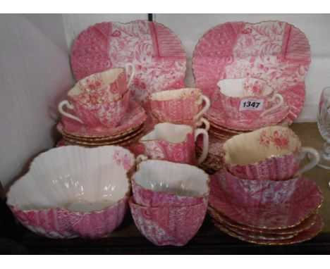 A 19th Century Wileman &amp; Co. Aesthetic Movement part tea set decorated in pink with a transfer printed japonesque design 