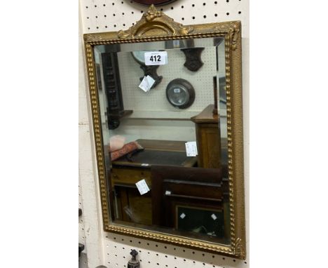A vintage small gilt framed bevelled oblong wall mirror