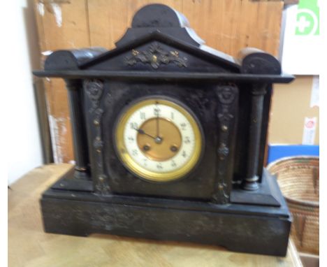 A late Victorian black slate cased mantle clock of architectural design with eight day gong striking movement - cornice detac