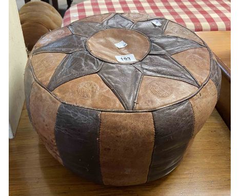 A vintage North African stitched leather pouffe with impressed decoration