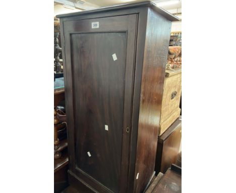 A late Victorian stained mixed wood pot cupboard enclosed by a panelled door