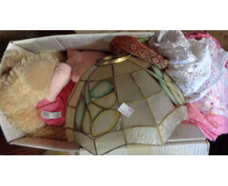 A box containing assorted textiles, lampshade, etc.