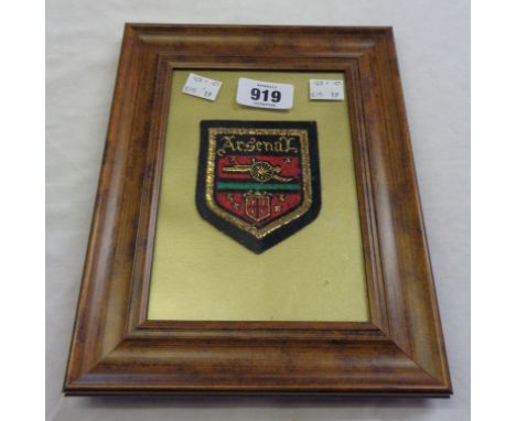 A framed 1971 Arsenal embroidered blazer badge