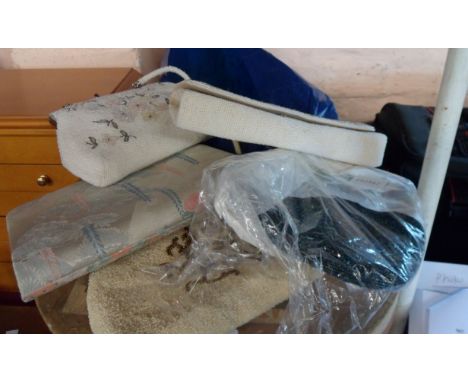 A bag containing a quantity of vintage and later handbags including beaded examples, etc.
