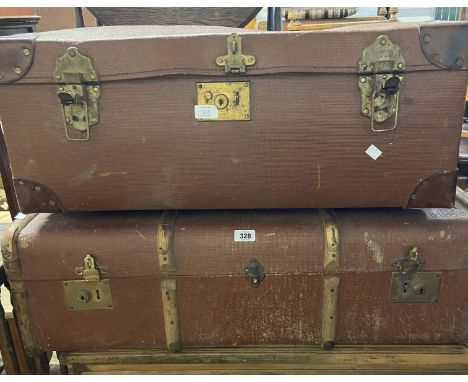A vintage cane bound and weather coated travelling trunk - sold with a large suitcase with leather bound corners