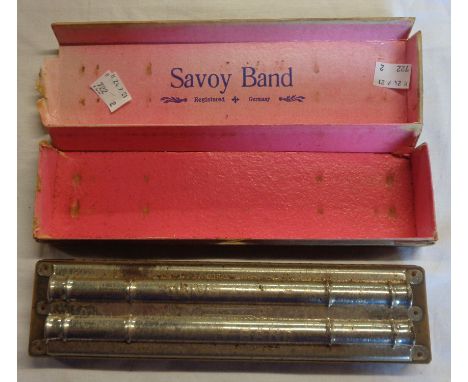 A boxed Savoy Band harmonica