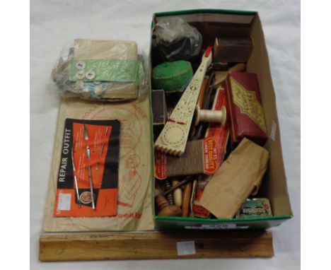 A small box containing assorted collectable items including tins, buttons, harmonica, etc.